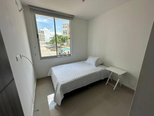 En eller flere senge i et værelse på Apartamento Ocarro Villavicencio