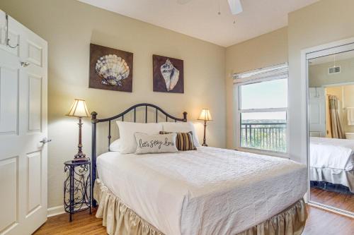 a bedroom with a large bed and a window at Charming Condo on the Beach/Legacy T2-1102 in Gulfport