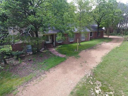 an aerial view of a house with a yard at Nashville Elegance Enjoy Southern Comfort in Style in Nashville