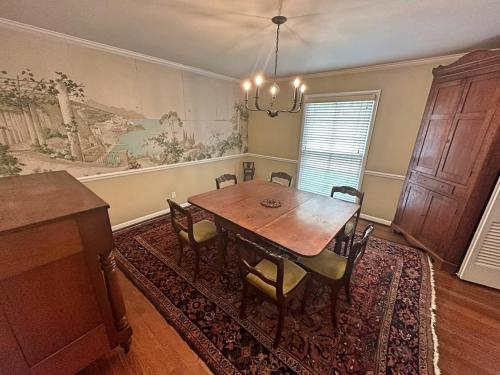 a dining room with a wooden table and chairs at Nashville Elegance Enjoy Southern Comfort in Style in Nashville