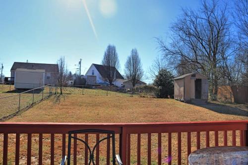 a view of a yard on a wooden deck at Beautiful cul-de-sac home with a fenced in yard! in Clarksville