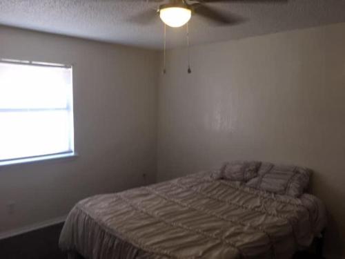 a bedroom with a bed and a ceiling fan at One bedroom close to Fort Sill! in Lawton