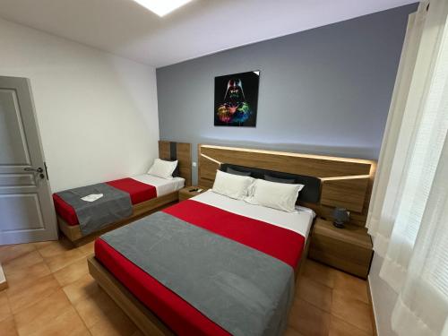 a room with two beds in a room at DOMAINE MAXXIM in Clermont-lʼHérault