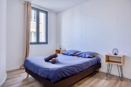 Ένα ή περισσότερα κρεβάτια σε δωμάτιο στο Maison T4 Climatisée avec Jacuzzi à Lagord