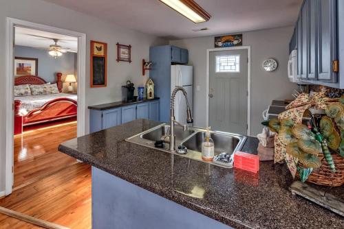 a kitchen with a sink and a counter top at Home near all Sevier County attractions! in Pigeon Forge