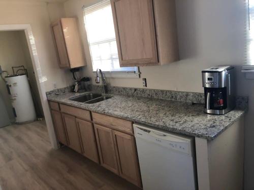 a kitchen with a sink and a counter top at A great place for you to come rest your head in Gallatin
