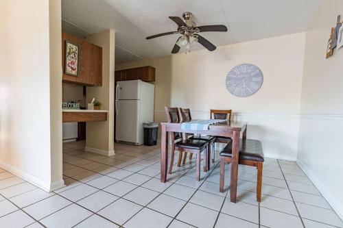 a kitchen with a table and chairs and a refrigerator at 2-bed, 2-bath apartment living experience in Chattanooga