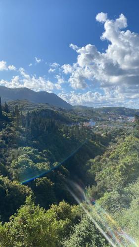 an aerial view of a valley with trees and a city at Eleni's Holiday Rooms in Himare