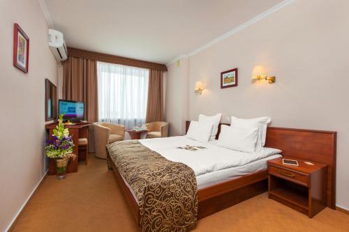 Cama o camas de una habitación en Conference Hotel Suputnyk