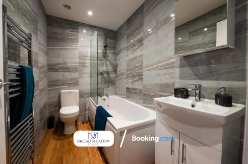 a bathroom with a white sink and a toilet at 2 Bedroom, Brand new property By Broad Meadow Stays Short Lets and Serviced Accommodation Lincoln With Garden in Lincoln