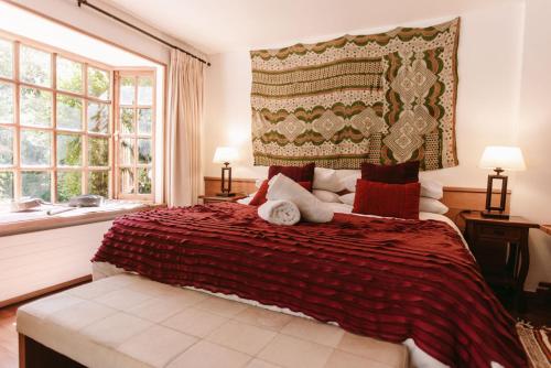 Postel nebo postele na pokoji v ubytování Hotel Posada del Río - Parque Metreñehue
