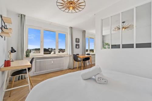 a white bedroom with a large white bed and a desk at Tranquil Retreat in the Vianden ID224 in Luxembourg