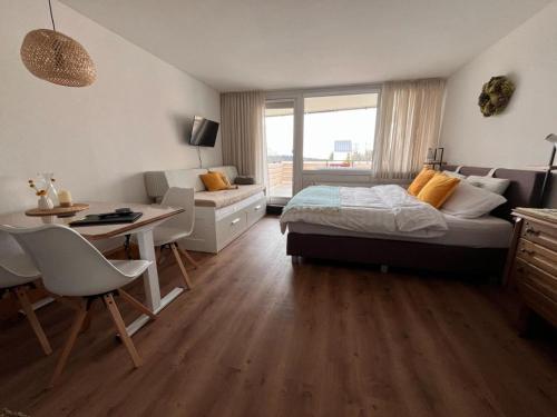 Postel nebo postele na pokoji v ubytování Exil Apartment