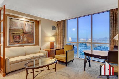 a living room with a couch and a table at MGM Signature-09-716 Jacuzzi Studio in Las Vegas
