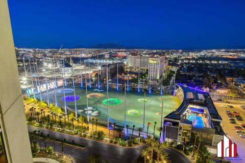 a view of a city at night with a water park at MGM Signature-20-620 1Br 2Ba Balcony Suite in Las Vegas