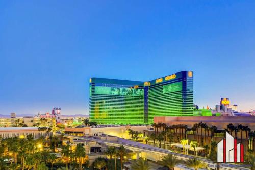 a view of a large building with palm trees at MGM Signature-07-620 1Br 2Ba Balcony Suite in Las Vegas