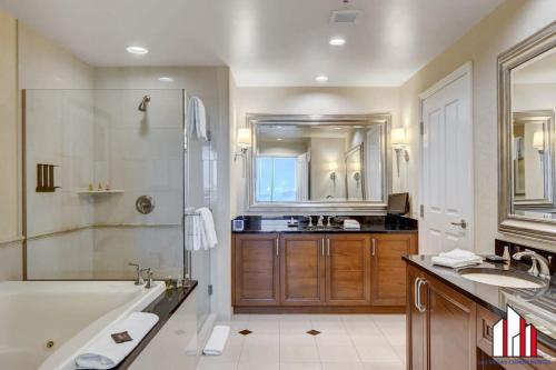a large bathroom with a tub and a sink at MGM Signature-31-702 1Bedroom 2Bath Balcony Suite in Las Vegas