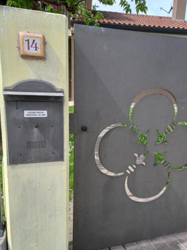a large metal door with a number on it at Casa vacanze La Madonnetta in Arcade