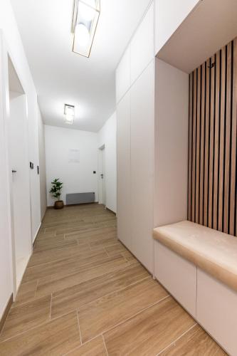 an empty hallway with white walls and wood floors at Villa Koludrovac in Kaštela