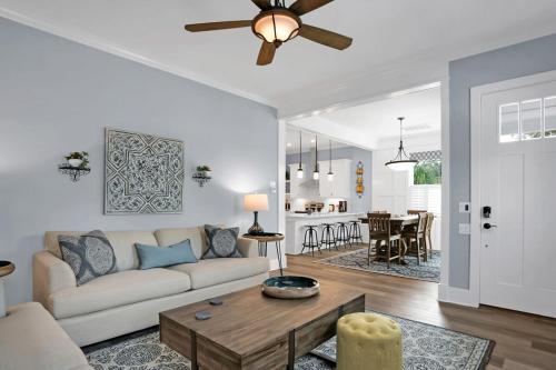 a living room with a couch and a table at Blue House, Prime Location, Family Amenities, BBQ! in St. Augustine