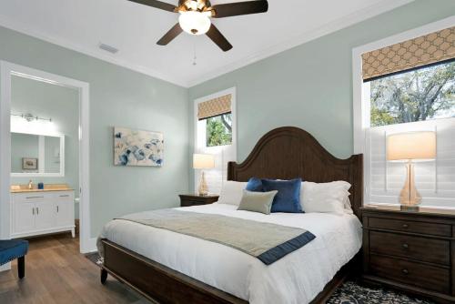 a bedroom with a bed and a ceiling fan at Blue House, Prime Location, Family Amenities, BBQ! in Saint Augustine