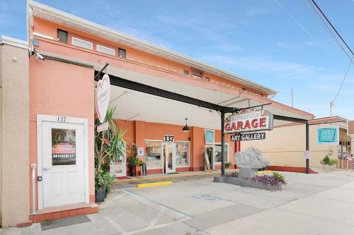 a grocery store with a sign for a garage at Park It At the Butterfield Garage, Historic Pre-Prohibition Style Apt in the Heart of Downtown in St. Augustine