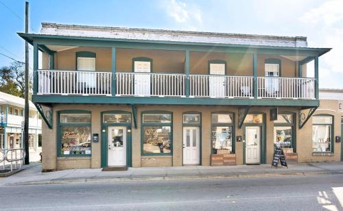 a building with a balcony on top of it at City Living West Downtown St Aug Apartment in St. Augustine