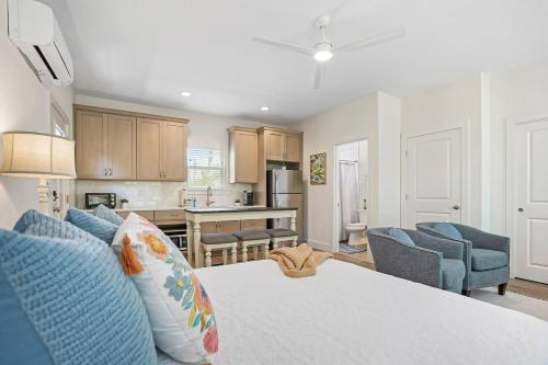 a kitchen and living room with a bed and chairs at New Private Apt in Uptown St Aug Walk Everywhere in St. Augustine