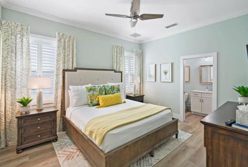 a bedroom with a bed and a dresser and a window at Lincolnville Luxe Upscale Home in Heart of St Aug in Saint Augustine