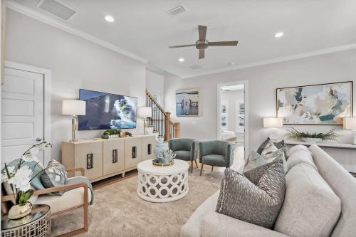 a living room with a couch and a table at Steps to Ice Plant in Historic St Aug Upscale in St. Augustine
