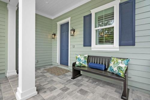 a porch with a bench and a window at Steps to Ice Plant in Historic St Aug Upscale in St. Augustine