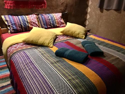 Una cama o camas en una habitación de Kasbah Mashallah