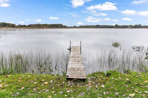 a wooden dock in the middle of a lake at 4 BR 2 BA Peaceful Getaway Year Round on Park Lake in Bath