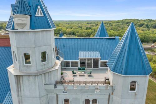 an aerial view of a house with a blue roof at Extravagant 3 Level Penthouse at The Grand Castle in Grandville