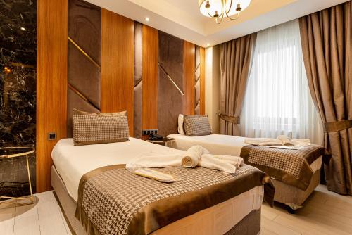Cama o camas de una habitación en Santra Hotel