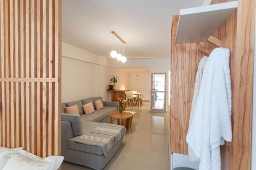 a living room with a couch and a table at Museo Paseo de la Cisterna, UF 431 in Buenos Aires