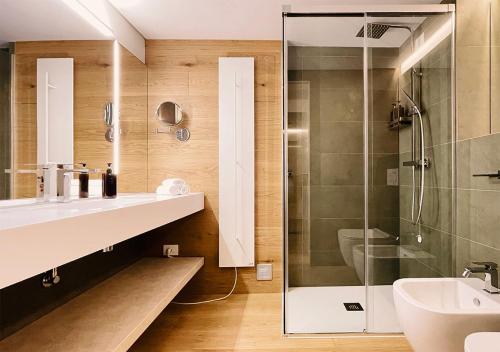 a bathroom with a sink and a shower at Al Pio Luxury Nest in Treviso