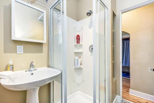 a bathroom with a sink and a shower at Heritage home near Byward Market downtown Ottawa in Ottawa