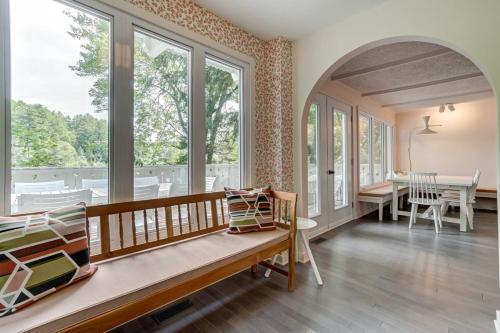 a living room with a bench and windows at Family chalet in the heart of Wakefield in Wakefield