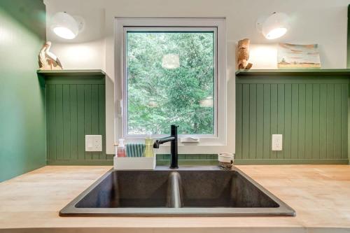 a kitchen with a sink and a window at Family chalet in the heart of Wakefield in Wakefield