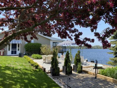a house with a view of the water at The Verne: Beautiful Waterfront Escape by Picton in Picton