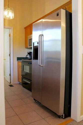 a kitchen with a stainless steel refrigerator in a kitchen at 20 mins to Nashville, fenced yard included in Goodlettsville