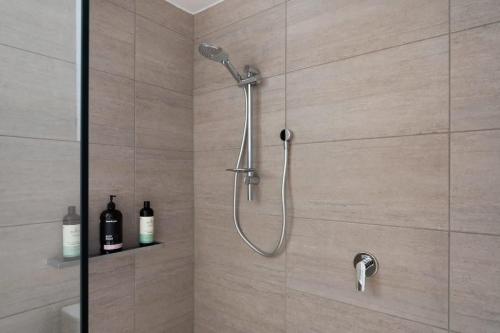 a shower with a shower head in a bathroom at Renovated Delight in Invermay in Invermay