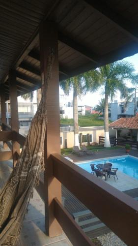 a view from the balcony of a resort with a swimming pool at Pousada Doce Vida in Marechal Luz