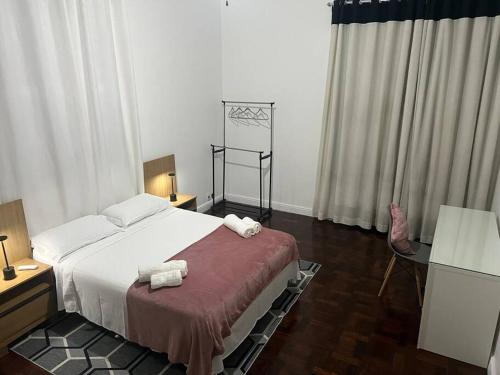 A bed or beds in a room at Casa Aconchegante-Rio de janeiro