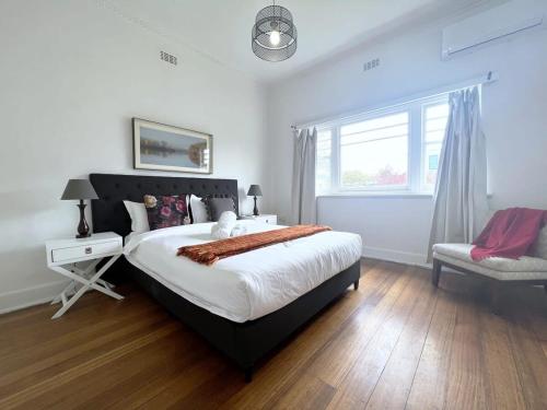 a bedroom with a large bed and a window at Unit In Preston For Family in Melbourne