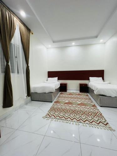 Postel nebo postele na pokoji v ubytování فندق ريلاكس ثرو للشقق المخدومة