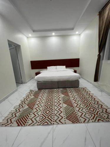 Postel nebo postele na pokoji v ubytování فندق ريلاكس ثرو للشقق المخدومة