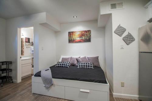 A bed or beds in a room at 34B- Modern studio condo heated pool and dog park