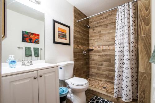 a bathroom with a toilet and a shower at 41A Modern Large Studio Condo w heated pool in Casa Grande